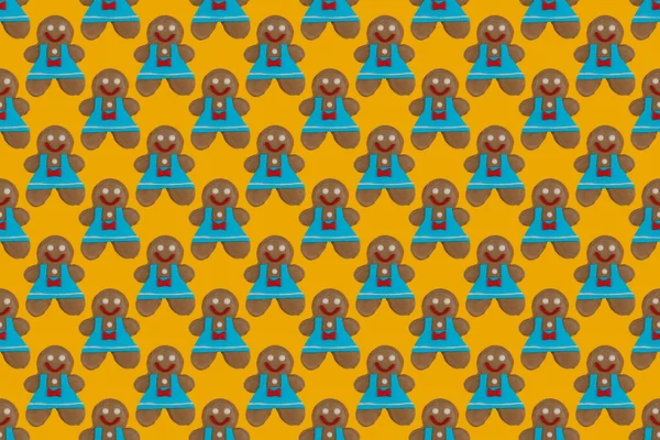 gingerbread man pattern. cookies on a yellow background. traditional sweet treats and gifts for Christmas and new year holidays.