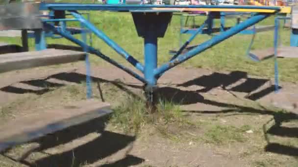 Old Metal Swing Children Carousel Moving Empty Abandoned City Playground — Stock Video