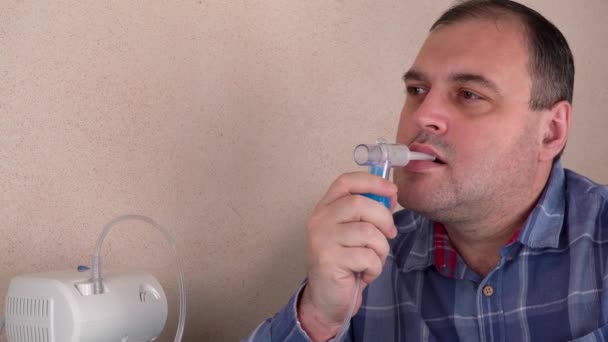 Man Holds Breathing Mask Inhales Nebulizer Oxygen Mask Spraying Drug — Stock Video