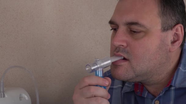 Man Holds Breathing Mask Inhales Nebulizer Oxygen Mask Spraying Drug — Stock Video