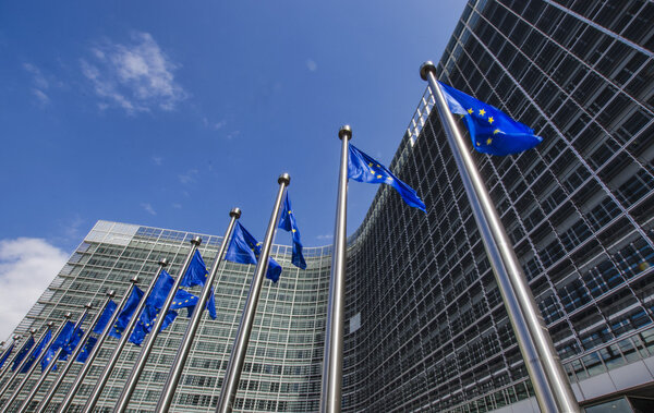 EU flags in front of European Commission in Brussels
