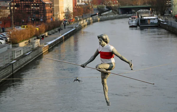 The Tightrope Walker in white red shirt - Bydgoszcz, Poland