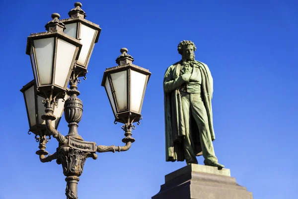 Iron lantern on the background of the monument to Alexander Push — Stock Photo, Image