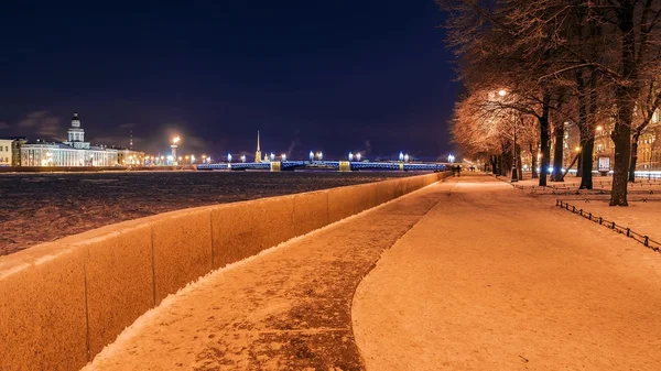 Admiralty Embankment at night in St. Petersburg in winter