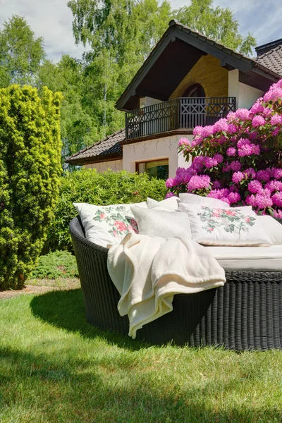 Rattan sofa with decorative cushions — Stock Photo, Image