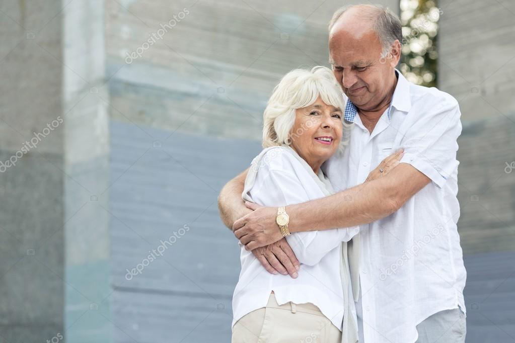 Senior man embracing his wife