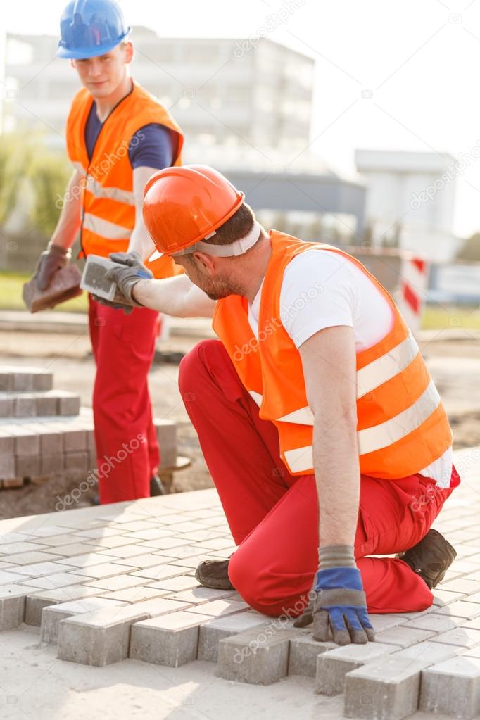 Worker making new pavement