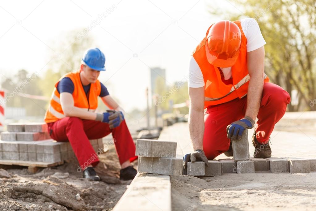 Two builders on construction site