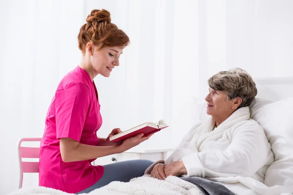 Young carer with old patient — Stock Photo, Image
