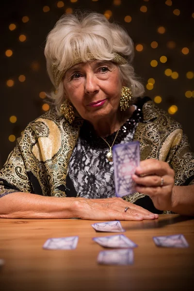 Old woman telling the future — Stock Photo, Image