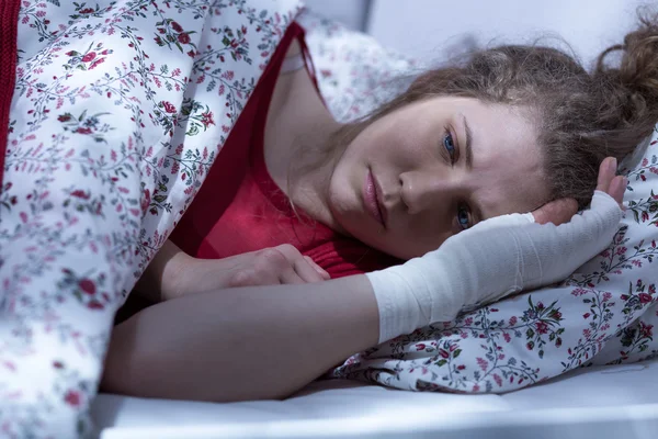 Woman with bandage on hand — Stock Photo, Image