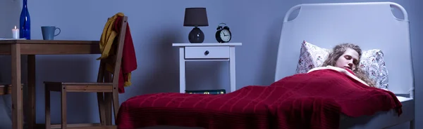 Depressed woman resting in bed — Stock Photo, Image