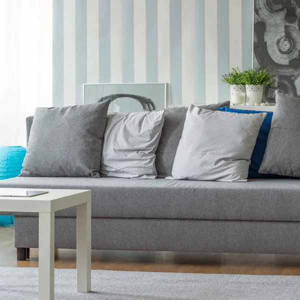 Grey sofa with small pillows — Stock Photo, Image