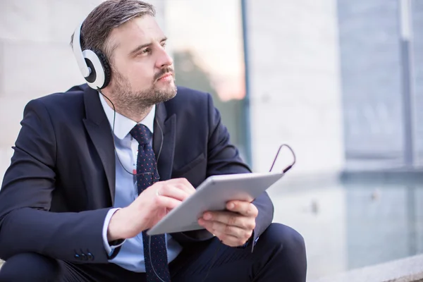 Modern businessman and music — Stock Photo, Image