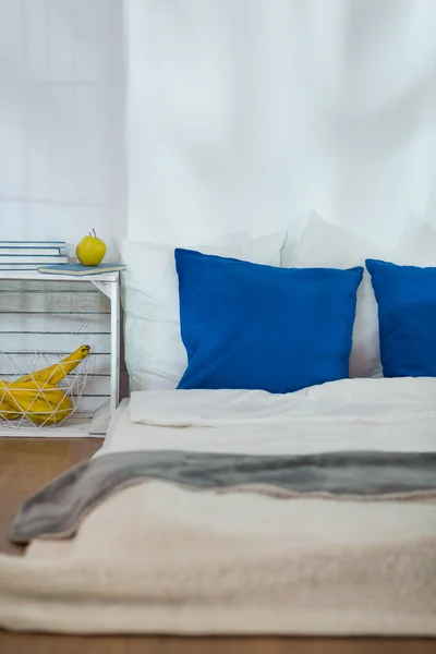 Modest bedroom with mattress as a bed — Stock Photo, Image