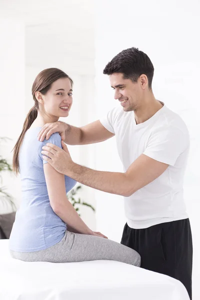 Positive physiotherapist and his content patient — Stock Photo, Image