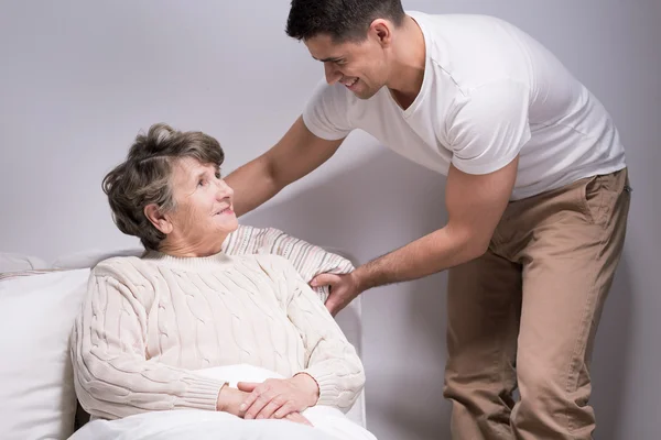 Taking care of his beloved grandma — Stock Photo, Image