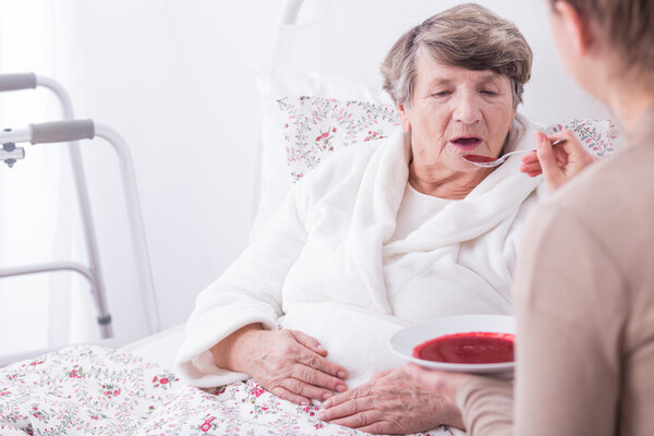 Disabled old woman having care