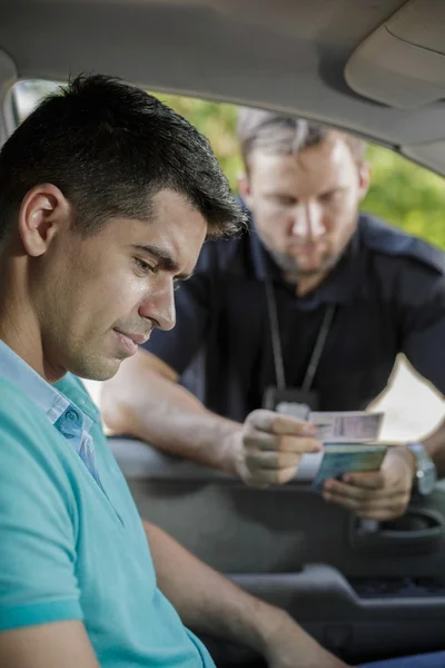 Looking at driving licence — Stock Photo, Image
