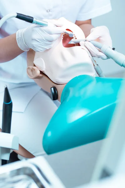 Close-up of student working with dental drill — Stock Photo, Image