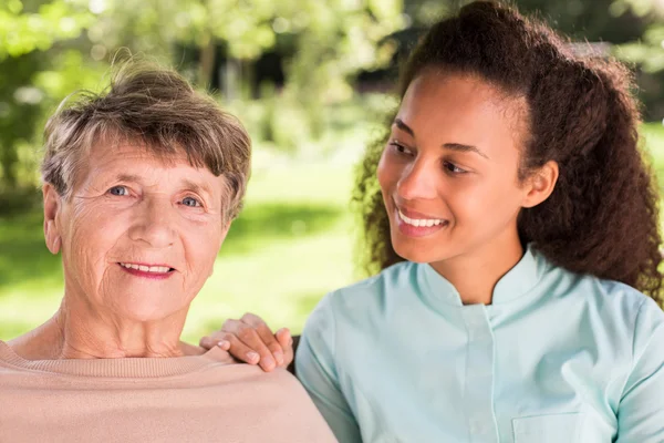 Portrait of woman and caregiver — Stock Photo, Image
