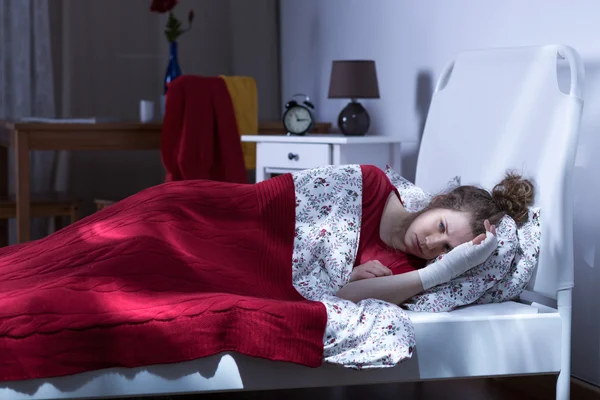 Depressed female lying in bed — Stock Photo, Image