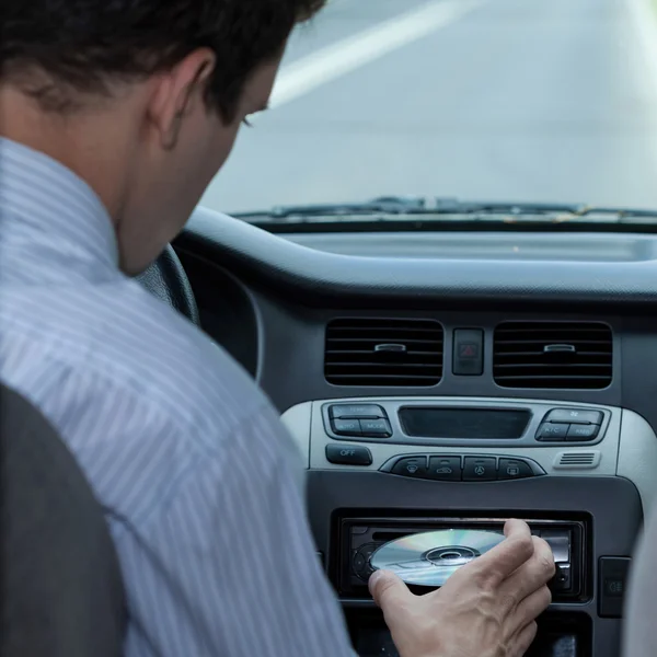 Inserting CD in the car — Stock Photo, Image