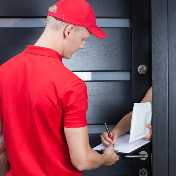 Courier waiting for a signature — Stock Photo, Image