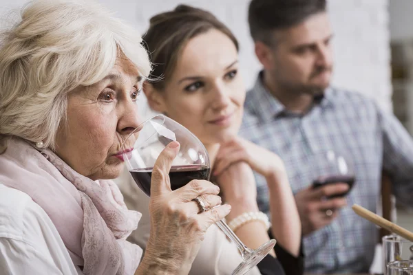 Senior woman drinking wine — Stock Photo, Image