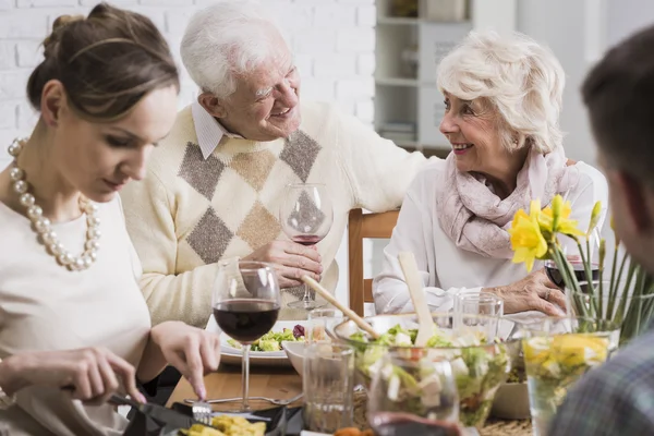 Happy senior marriage sitting at the table — Stock Photo, Image