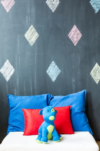 Mascot on the bed — Stock Photo, Image