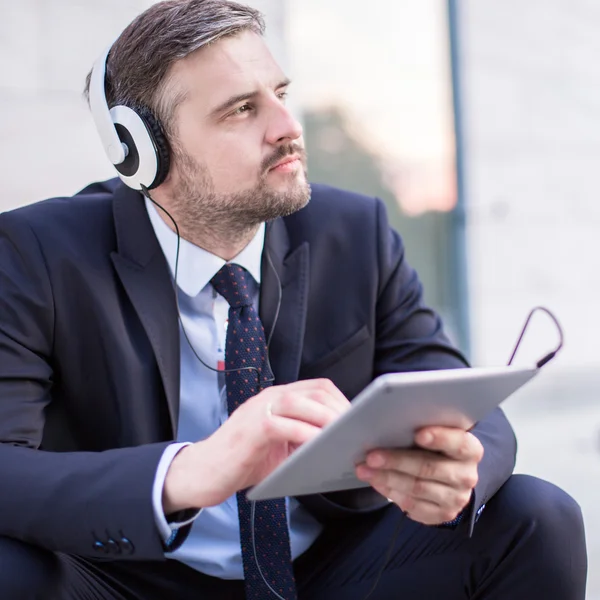 Modern businessman and music — Stock Photo, Image