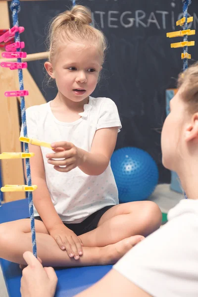 Patient girl concentrated on exercise — Stock Photo, Image