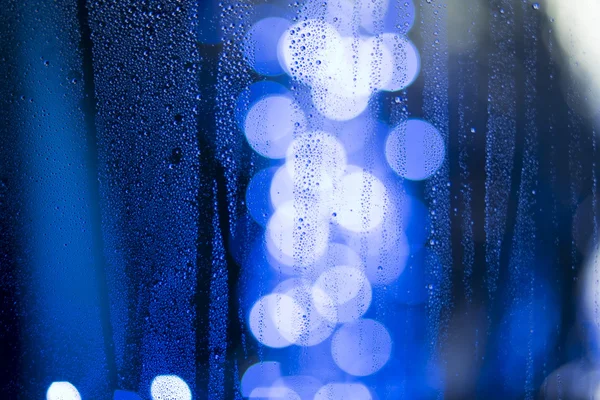 Luces azules y lluvia —  Fotos de Stock