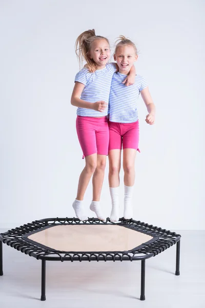 Jumping on trampoline — Stock Photo, Image