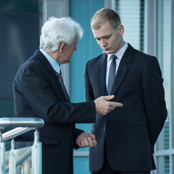Boss talking with young worker — Stock Photo, Image