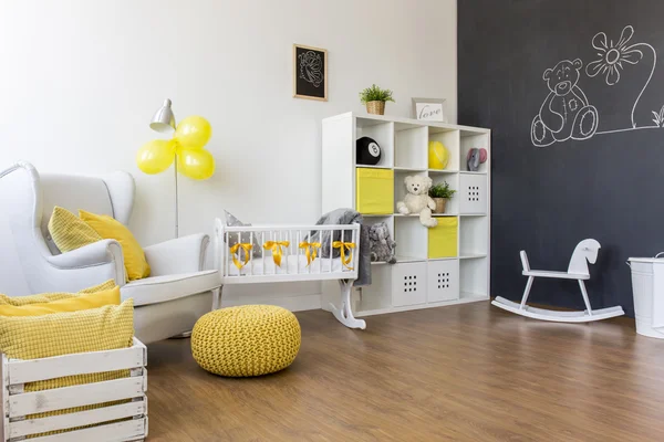 Yellow decorations in baby room — Stock Photo, Image