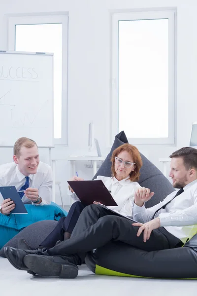 People sitting on bean bags — Stock Photo, Image