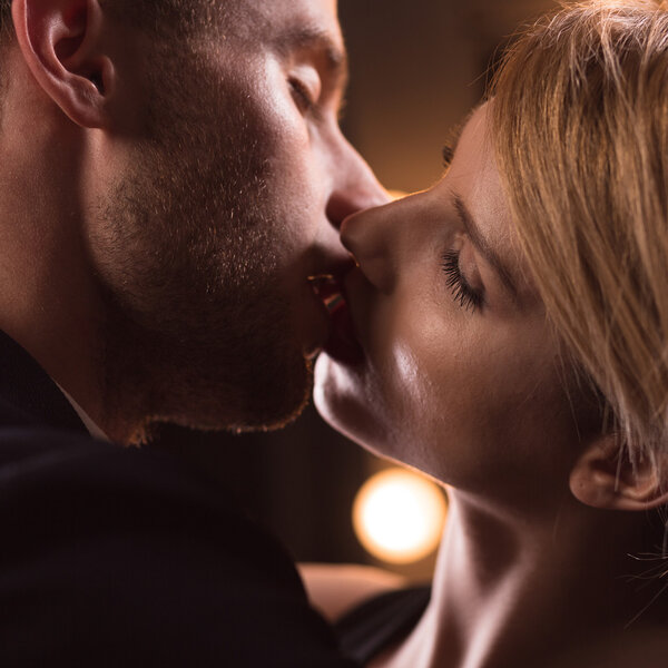 Handsome couple having French kiss