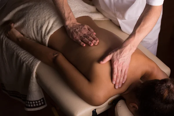 Gentle hands of an experienced masseur — Stock Photo, Image