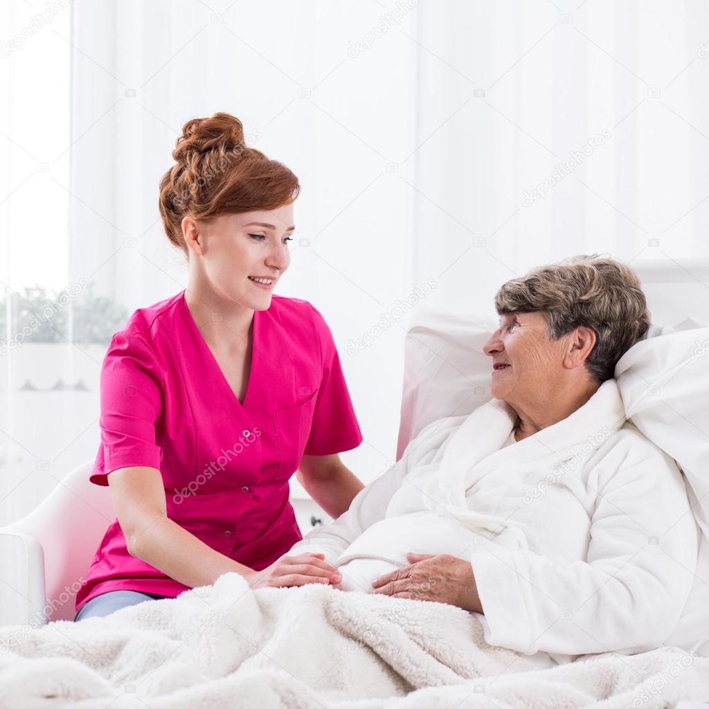 Young nurse and elderly woman