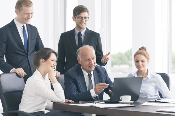 Enjoying impressive results of team work — Stock Photo, Image