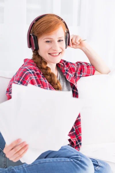 Relaxed student with impressive red braid — Stock Photo, Image