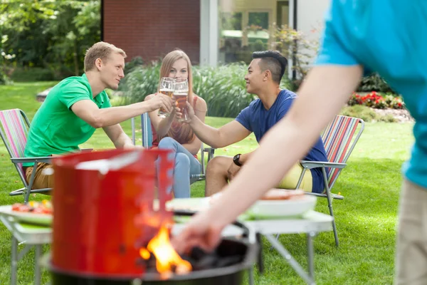 Party with barbecue in a garden — Stock Photo, Image