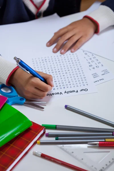 Close-up of boy doing homework — Stock Photo, Image