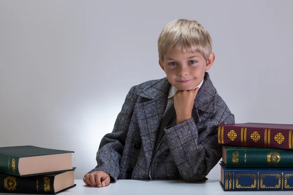 Happy nerd among books — Stock Photo, Image