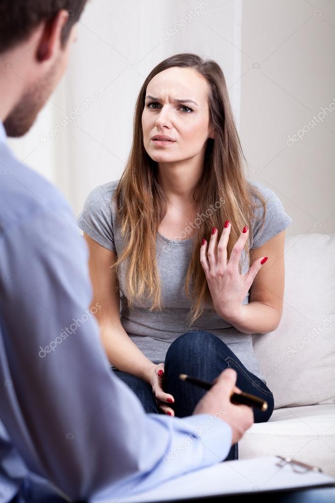 Psychiatrist talking with his young patient