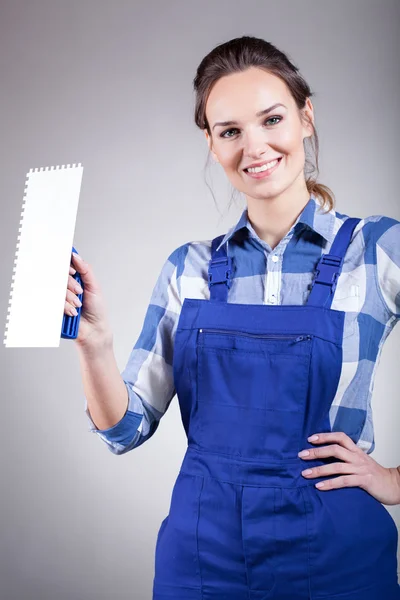 Beautiful handywoman with trowel — Stock Photo, Image