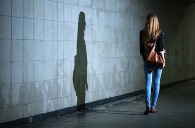 Woman walking alone at night clipart