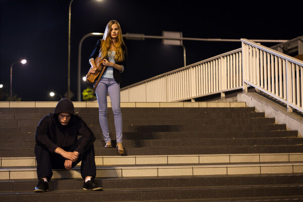 Woman on railway station at night